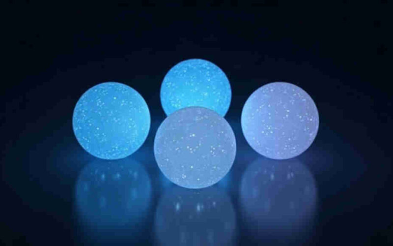 Four glowing spheres arranged in a square representing four AI companies